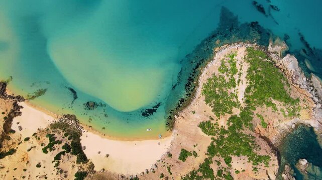 An aerial perspective of a small island off the coast of El Gliaa in Bizerte, Tunisia. The image highlights the island's lush greenery and surrounding turquoise waters.