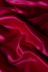 Luxurious silky fabric in deep magenta with elegant folds and soft lighting. Perfect for fashion design, textile backgrounds, branding, digital art, beauty aesthetics, romantic themes