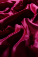 Luxurious silky fabric in deep magenta with elegant folds and soft lighting. Perfect for fashion design, textile backgrounds, branding, digital art, beauty aesthetics, romantic themes