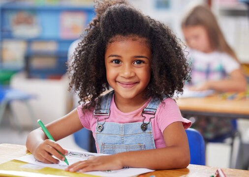 School, child and portrait with coloring in classroom for creative test, learning development or art activity. Kindergarten, girl student or happy for drawing assessment, project or fine motor skills