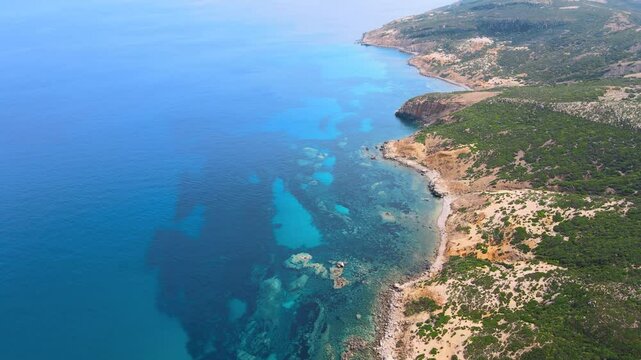 An expansive view of the ocean near El Gliaa in Bizerte, featuring vibrant blue waters and a rugged coastline. Ideal for those seeking natural beauty and tranquility.