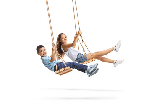 Happy children swinging on a swing
