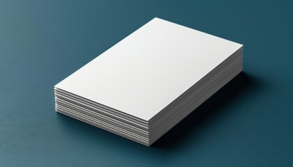 A stack of white paper is on a blue surface