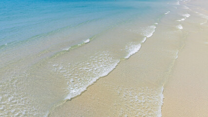 nature of the beach and sea Summer with sunshine, sandy beaches, clear blue waters sparkling against the blue sky. On an island with good ecology and environment Background for summer vacation