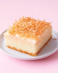 A minimalist composition of a traditional Thai Foi Thong cake slice on a simple white plate. Layers of light vanilla sponge cake with creamy coconut frosting, topped with glossy golden Foi Thong