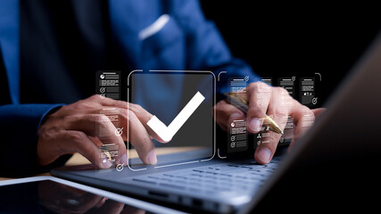 Businessman tick mark an assessment, online survey online exam choose the right answer in the exam,...