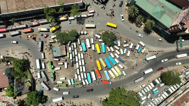 Aerial view of a bustling matatu terminus with colorful buses and busy streets, Nairobi, Nairobi, Kenya.