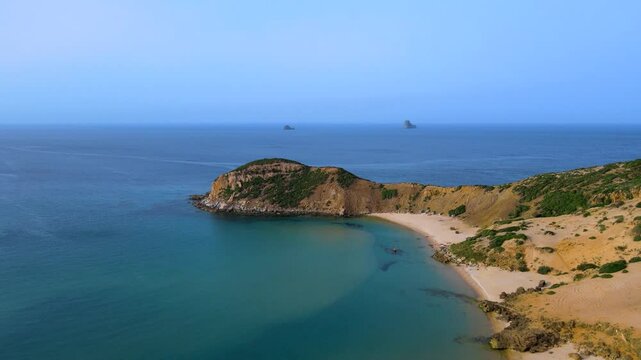 This stunning aerial shot captures the beautiful coastal landscape of El Gliaa in Bizerte. The video showcases the turquoise waters, sandy beaches, rocky cliffs, and distant islands.