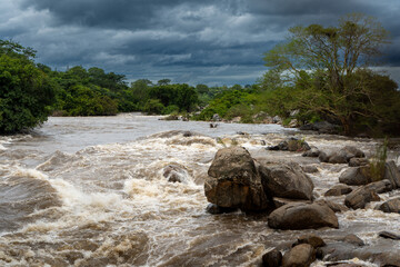 Raging Rapids of the Shire River in Malawi Under a Stormy Sky