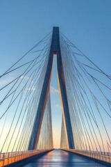 Obraz premium Modern Cable-Stayed Bridge with Minimalist Design at Golden Hour under Clear Sky