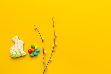 Easter homemade bunny cookies and eggs with willow branches, top view