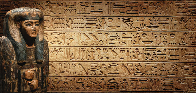Sarcophagus with an Egyptian mummy on old Egyptian hieroglyphs. Ancient Egyptian hieroglyphs as a symbol of the history of the Earth. 