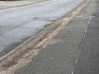 An asphalt pedestrian side walk in a countryside village in Germany 