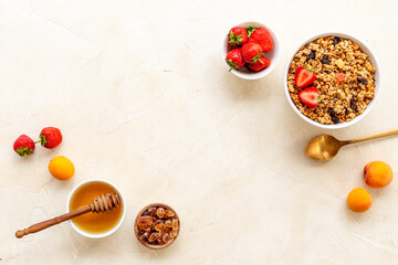 Top view of breakfast with oatmeal granola and ingredients. Healthy morning routine