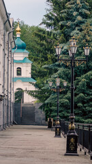 bottom view golden domes of christian church with crosses on blue sky background