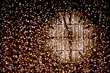 Christmas countdown - large clock behind a light curtain