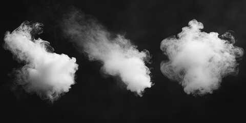 There are three distinct types of smoke visible on a black background
