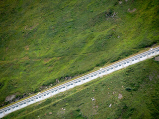 Steep uphill road in a green mountain landscape