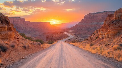 Golden hour sunlight illuminates a desert canyon's rugged slopes a winding dirt road invites exploration, stretching into the distance.