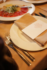 The festive table is set with dishes and utensils.