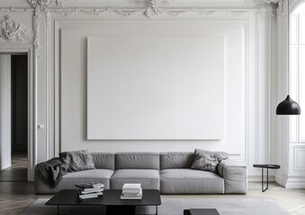 Modern grey sofa in elegant living room with large blank canvas.