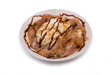 Raw, fresh chicken in chicken sauce.
Clipping path included.