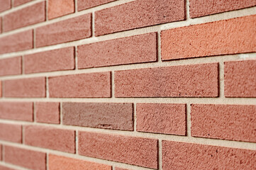 Obraz premium Close-up of red brick wall texture highlighting clean lines and vibrant colors suitable for backgrounds or architectural-themed projects with urban appeal