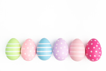 row of easter egg white background empty blank copy space april event spring celebration