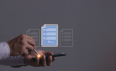 Young man with smartphone mobile hand using a pen touching to sign a Electronic signature, Online Business Contract, Digital documents, Future smart contract, Contract signing