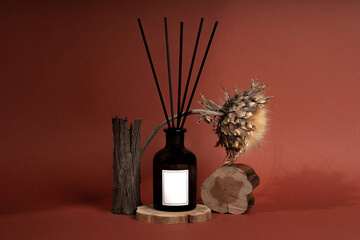 Beautiful diffuser bottle in brown glass jar on wood texture. Home decor, aromatherapy rest...