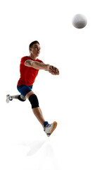 Naklejka premium Full-length image of competitive young guy, volleyball player in uniform training, playing against white studio background. Concept of sport, competition, strength, active lifestyle, determination.