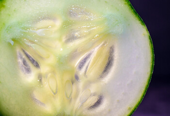 Macro of slices cucumber on black background, close-up of slices cucumber