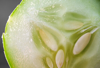 Macro of slices cucumber on black background, close-up of slices cucumber