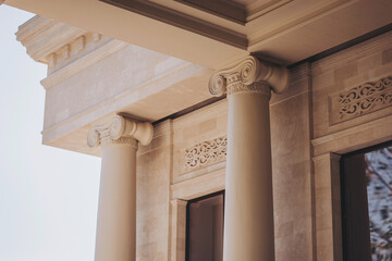 features stunning classical architecture highlighted by decorative columns, intricate carvings, and...
