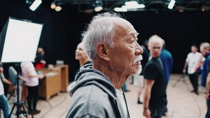 A Group of Diverse Adult Men in a Photography Studio Setting Engages in a Creative Photoshoot with a Focus on Collaboration and Interaction