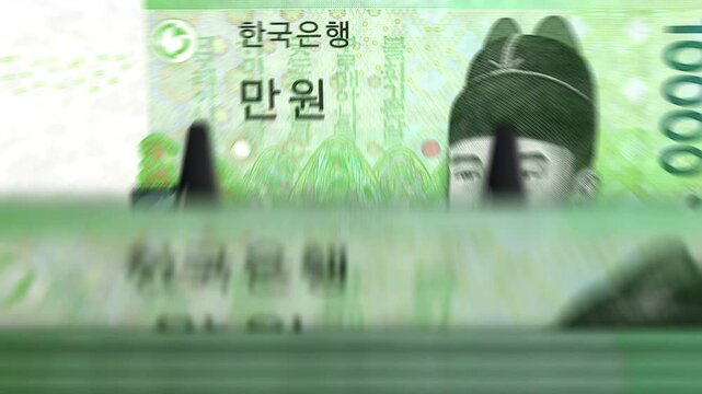 South Korea money Korean Won counting machine with banknotes. Quick 100 AWG currency note down rotation. Business and economy concept loopable and seamless background.