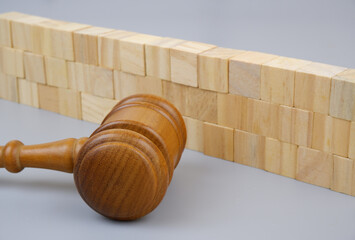 Judge gavel near wooden wall on gray background. Court protection and security concept.