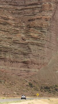 Bid red wall geological formation with rural road. Chubut, Ruta Nacional 25, Argentina