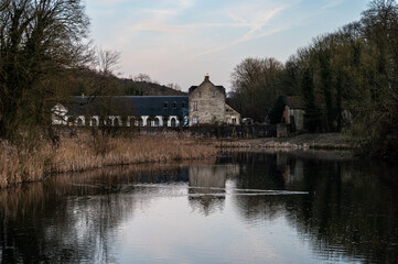 Fototapeta premium Sunset with reflections at the Rouge Cloître - Rood Klooster site in Auderghem, Brussels Capital Region, Belgium