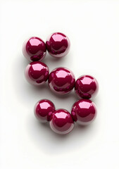 3D maroon spheres arranged in the shape of an "S" on a white background, creating an elegant and modern design element for graphic or digital media use.