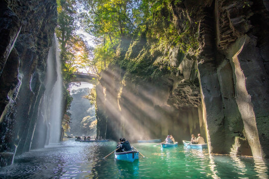 Takachiho, Japan - 15 November 2020: View of takachiho gorge with serene row boat and beautiful waterfall, kumamoto prefecture, japan.