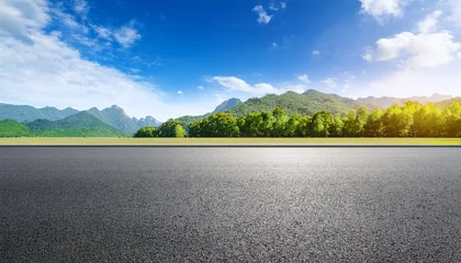 Gordijnen  Asphalt road square and green forest with mountain natural landscape under blue sky © Hadjnaas