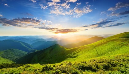  Beautiful sunrise over the green mountains in morning light with fluffy clouds on a bright