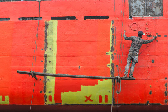 Dhaka, Bangladesh - 18 February 2025: View of vibrant shipyard with workers and ships undergoing repair, Dhaka, Dhaka Province, Bangladesh.