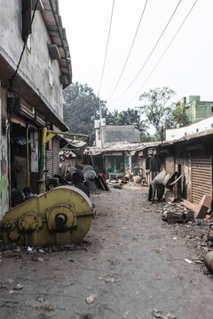 Dhaka, Bangladesh - 18 February 2025: View of industrial shipyard with machinery and people working, Dhaka, Dhaka Province, Bangladesh.