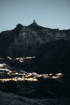 View of a tranquil village nestled in a serene mountain landscape at dusk, Rocco Noublo, Gran Canaria, Spain.
