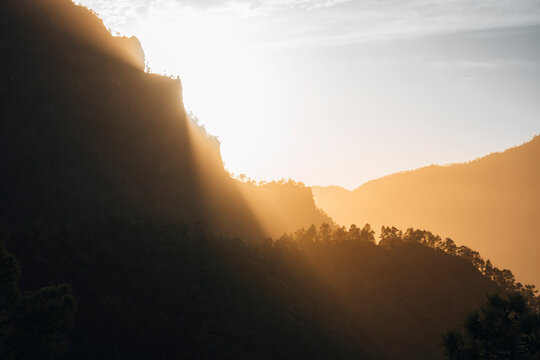 View of serene mountain landscape at sunrise with beautiful forest and dramatic sky, Mirador de La Cumbrecita, Santa Cruz de la Palma, Spain.