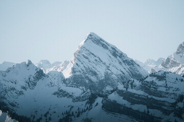 View of majestic snow-covered mountain peak in serene winter landscape, Amden, St. Gallen, Switzerland.