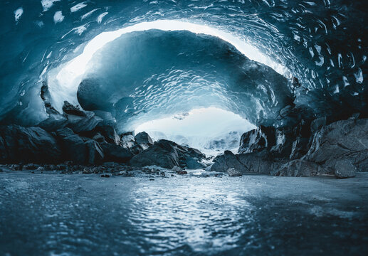 View of beautiful icy cave and majestic glacier in winter, Morteratsch, Graubunden, Switzerland.