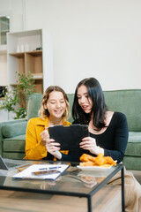 Explore vibrant teamwork, creativity, and learning with young adults using laptops and headphones...
